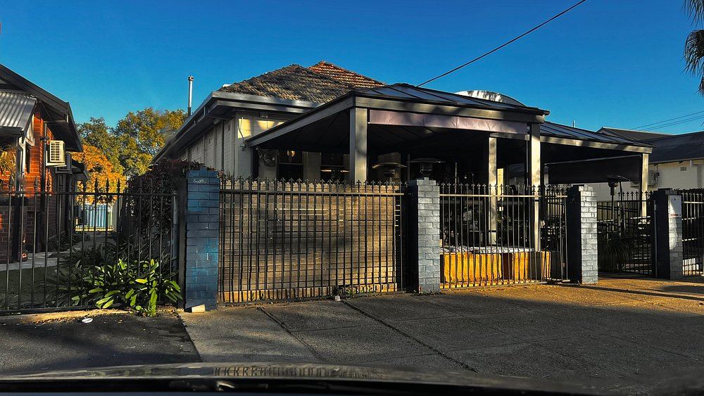 Dahab Cafe's timber-verandah storefront on Brisbane Street in the late afternoon